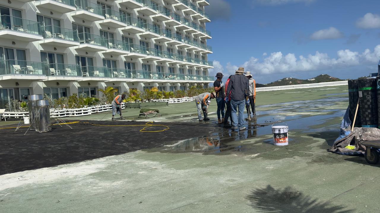 Maho Hotel — team applying waterproofing membrane on hotel terrace